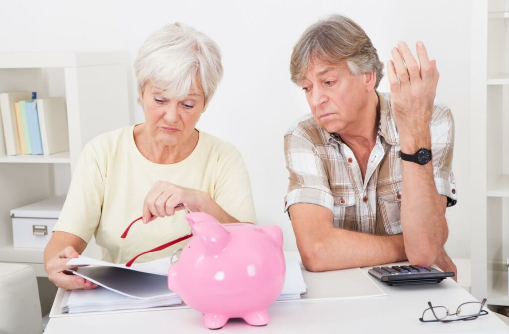 Elderly couple budgeting for an eye exam