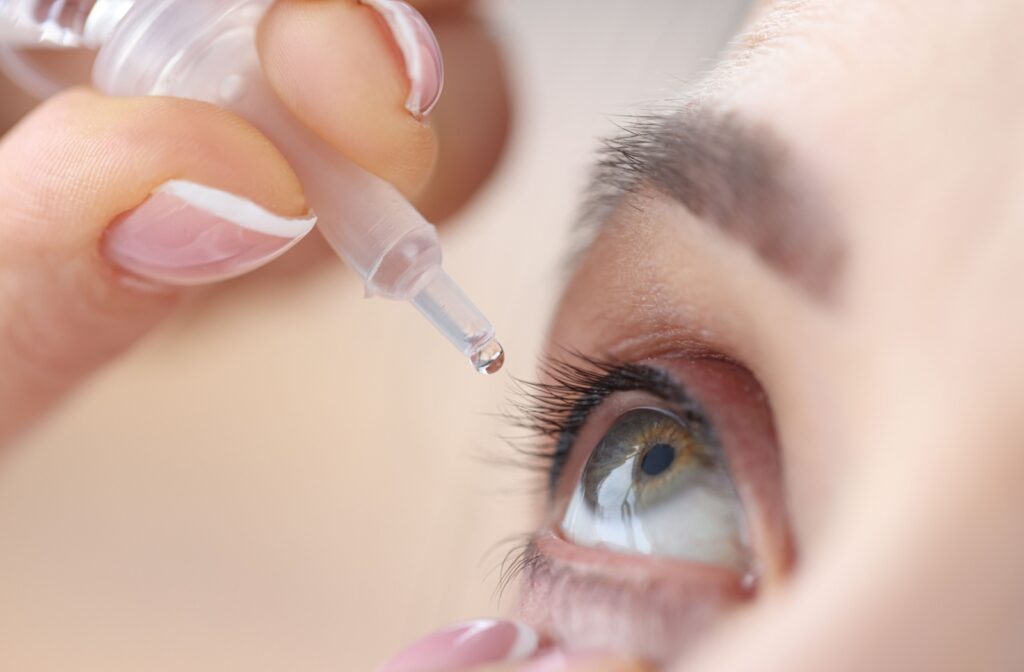 A dry eye sufferer using eye drops to help relieve symptoms